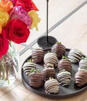 Alternative image 1 for Two dozen rainbow roses with one dozen chocolate covered strawberries.