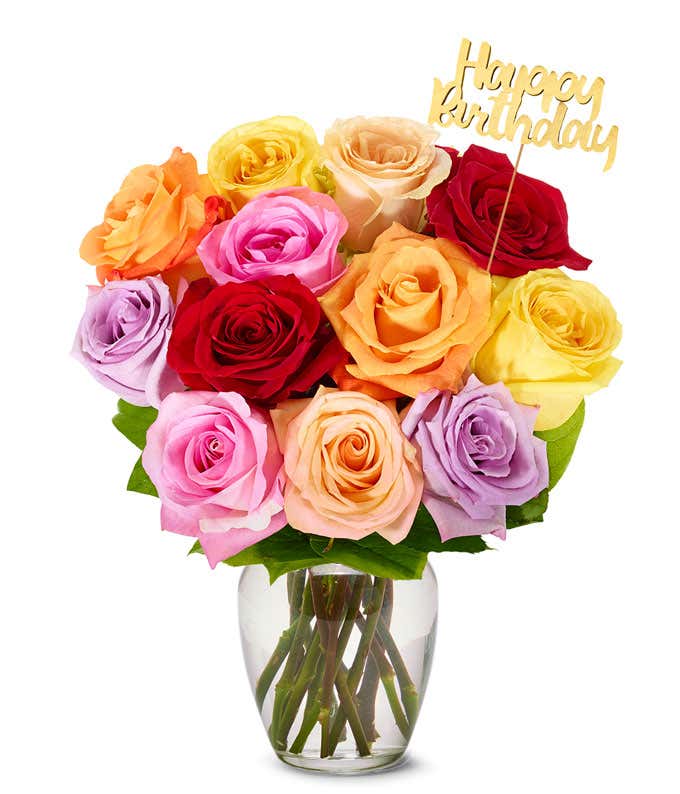 Assorted color roses with a gold pick saying Happy Birthday