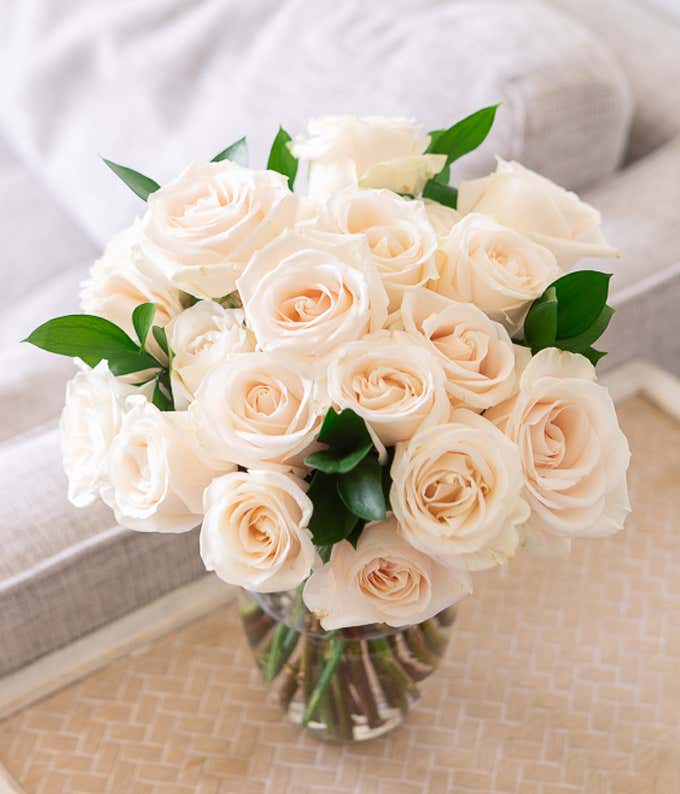 Two Dozen White Roses in Clear Glass Vase