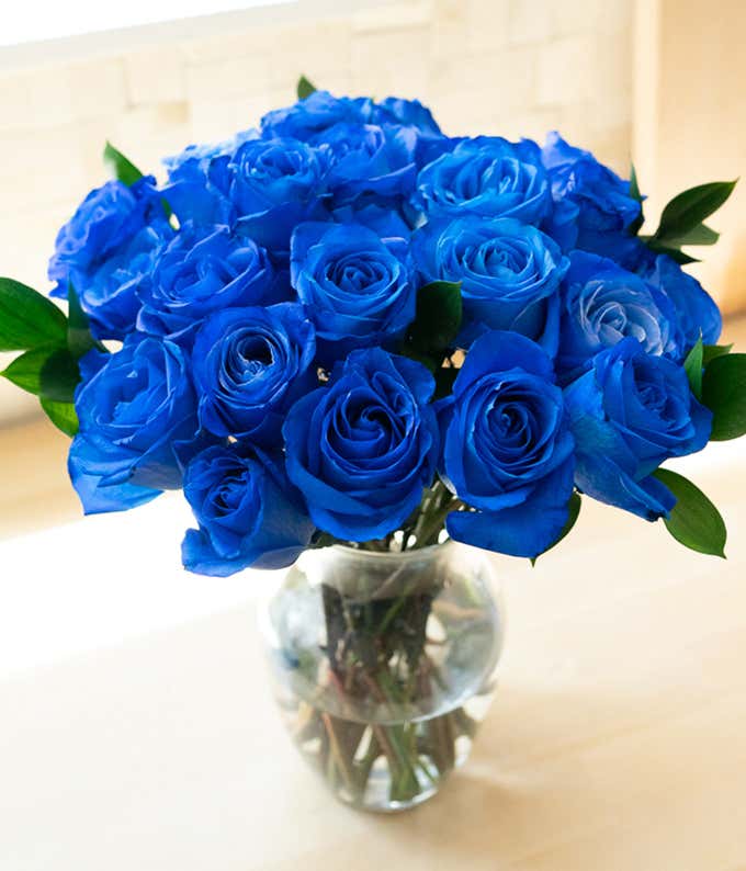 Two Dozen Long Stem Blue Roses in Clear Glass Vase