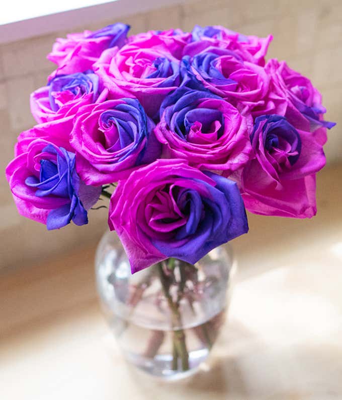 One Dozen Pink & Violet Cosmic Roses in Clear Glass Vase
