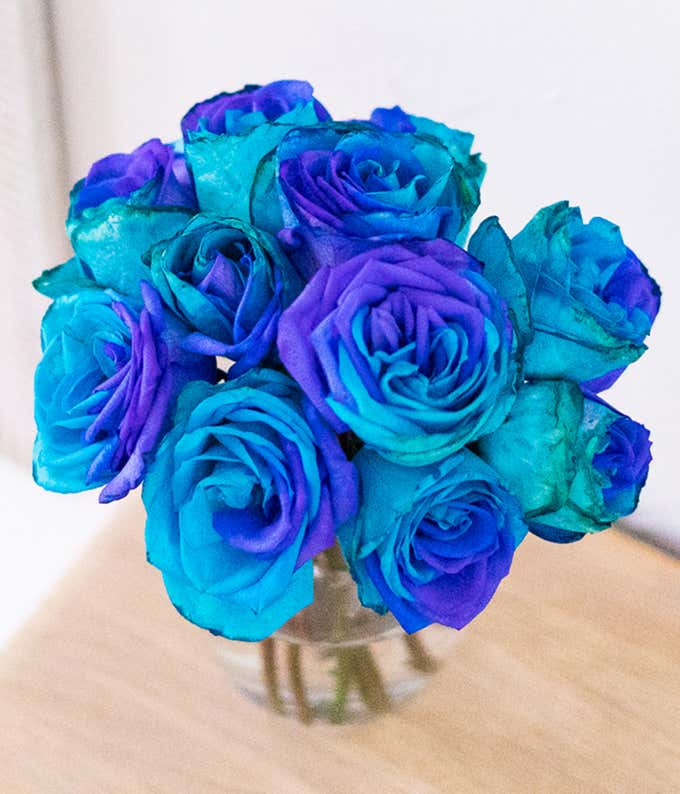 One Dozen Ocean Blue Roses in Clear Glass Vase