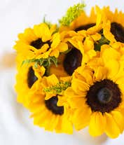 Alternative image 3 for A vibrant arrangement featuring yellow sunflowers and golden solidago, optionally presented in a vase. This bright and cheerful display brings a touch of sunshine and warmth to any occasion. 