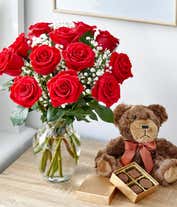 Alternative image 3 for A romantic gift set featuring long stem red roses, a box of chocolates, and a plush teddy bear. This perfect combination offers a heartfelt and memorable display for any special occasion.
