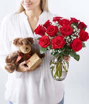 Alternative image 4 for A romantic gift set featuring long stem red roses, a box of chocolates, and a plush teddy bear. This perfect combination offers a heartfelt and memorable display for any special occasion.