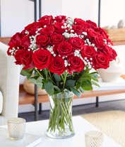 Alternative image 2 for Three dozen red roses with babies breath in a clear glass gathering vase