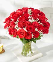 Alternative image 3 for Three dozen red roses with babies breath in a clear glass gathering vase