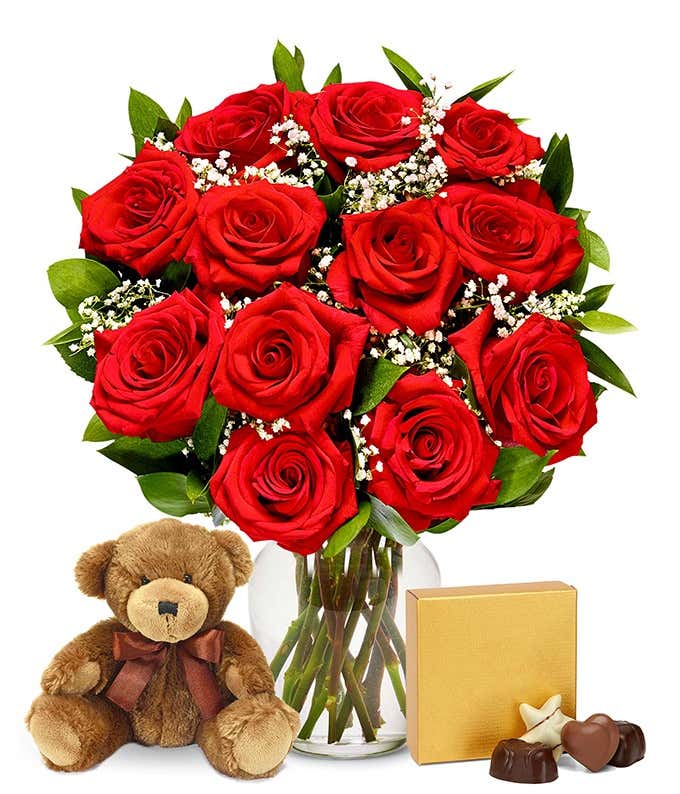 dozen red roses delivered with chocolate and a teddy bear