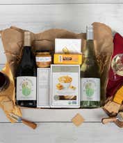 Alternative image 1 for A gift box with two bottles of California wine - Pinot Noir and Chardonnay, two types of cheese, crackers, stone-ground mustard, and a summer sausage.