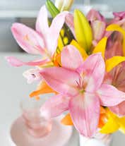 Alternative image 3 for A vibrant floral arrangement featuring pink lilies, orange lilies, and yellow lilies.
