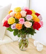 Alternative image 3 for An exquisite bouquet of roses in a kaleidoscope of colors—vivid reds, soft pinks, warm oranges, sunny yellows, and gentle purples—arranged in a clear glass vase, accompanied by a sleek bottle of rose wine from California, 2023, embodying grace and festivi
