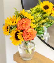 Alternative image 2 for A bouquet featuring yellow/orange bi-color roses, sunflowers, yellow button poms, yellow solidago, and bupleurum, with an optional vase.