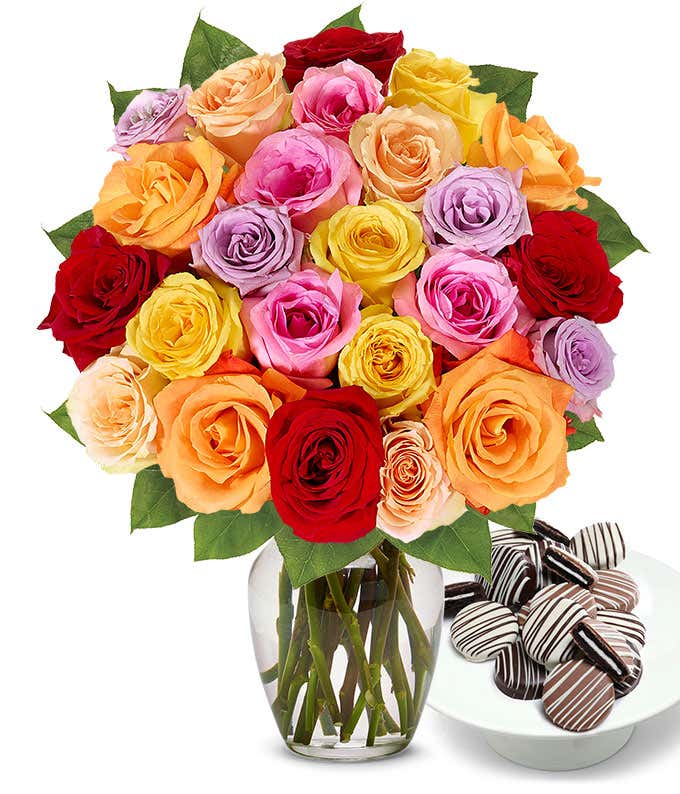 Two Dozen Rainbow Roses bouquet with a dozen Drizzle Chocolate Covered Oreos, optional glass vase, and personalized card message.