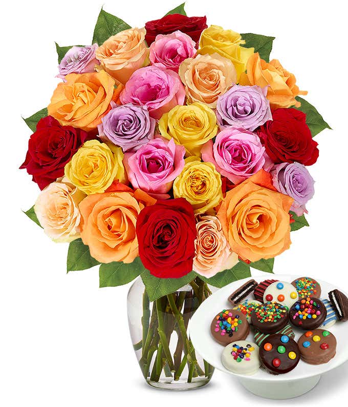 Two Dozen Rainbow Roses bouquet with a dozen Sprinkled Chocolate Covered Oreos, optional glass vase, and personalized gift message.