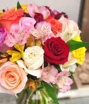 Alternative image 1 for A beautiful arrangement featuring mixed roses and assorted alstroemeria, optionally presented in a glass vase. This vibrant mix offers a colorful and cheerful display, perfect for any occasion.