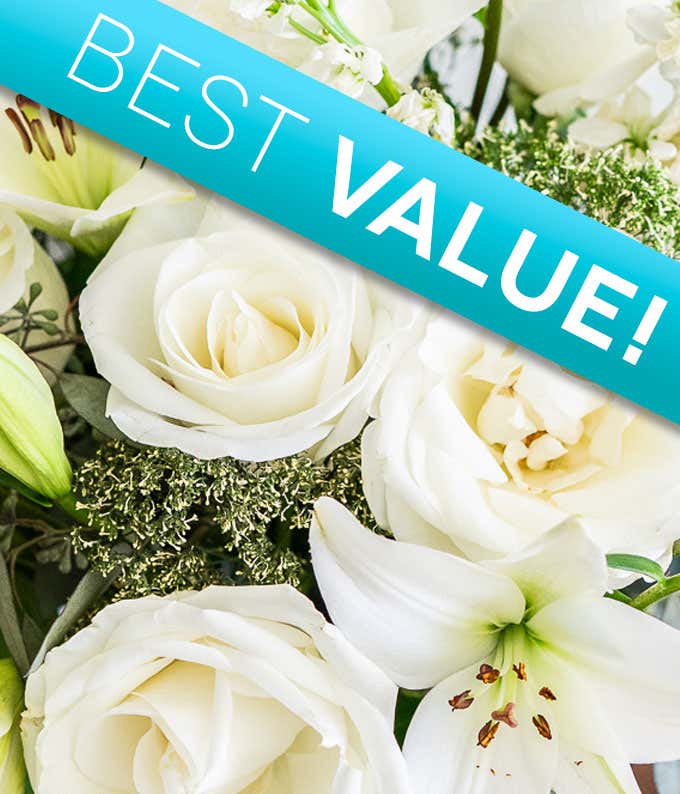 A close up picture of an all white flower bouquet.