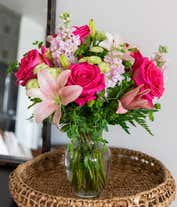 Alternative image 3 for Pink lilies, roses, and gilly flowers, with fresh floral greens in a clear glass vase
