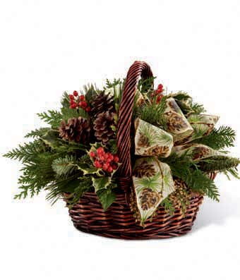 Holly, hypericum berries and Winter greens in basket