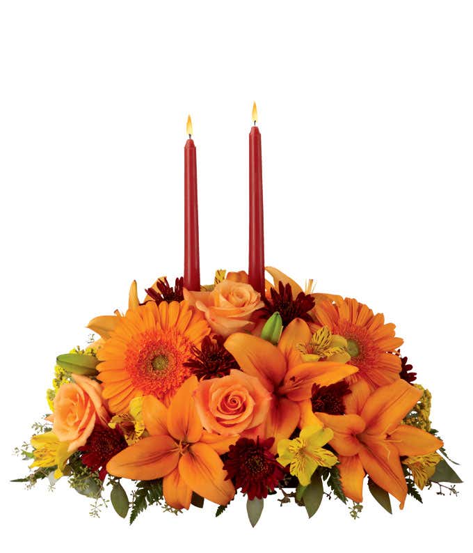 Thanksgiving table centerpiece with orange roses, lilies and gerbera daisies