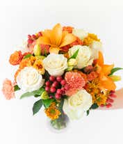 Alternative image 1 for Orange lilies, cream roses and orange roses are arranged for Fall delivery