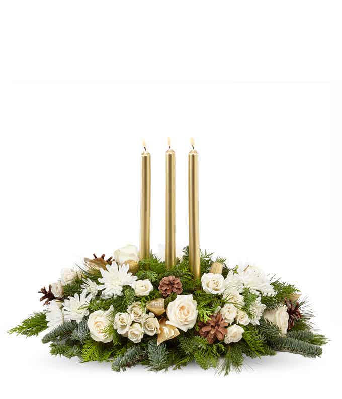 Winter flower centerpiece with gold candles