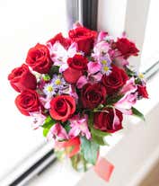 Alternative image 3 for Red roses arranged with purple alstroemeria and monte casino. 