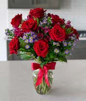 Alternative image 4 for Red roses arranged with purple alstroemeria and monte casino. 