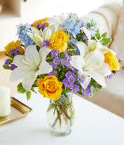 Alternative image 2 for Yellow roses, blue delphinium and white lilies in a vase for Mothers Day