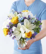 Alternative image 4 for Yellow roses, blue delphinium and white lilies in a vase for Mothers Day