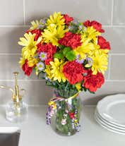 Alternative image 1 for Yellow daisies, red carnations and green button pops in a glass vase