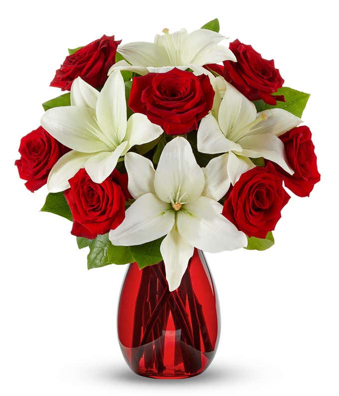 Red roses, white lilies in a vase