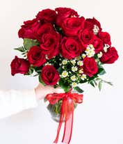 Alternative image 3 for One Dozen Red Roses with monte casino in a glass vase with a red bow