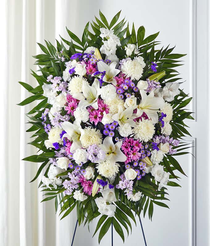 Lavender & white standing sympathy spray with roses