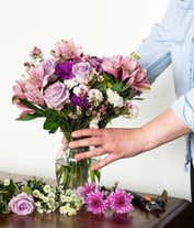 Alternative image 2 for A beautiful arrangement of seasonal flowers, elegantly presented in a glass vase. This dynamic mix of flowers changes with the seasons, offering a fresh and ever-changing display throughout the year.