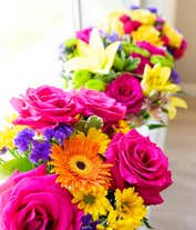 Alternative image 3 for A beautiful arrangement of seasonal flowers, elegantly presented in a glass vase. This dynamic mix of flowers changes with the seasons, offering a fresh and ever-changing display throughout the year.