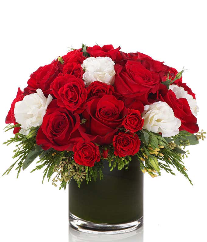 Red roses with White Lisianthus in a round vase