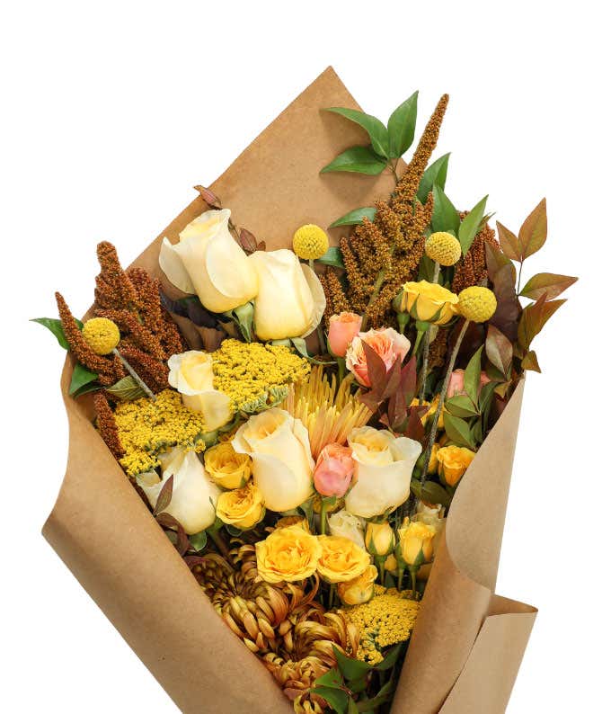 Wrapped bundle of Yellow, Cream, Bronze, and Peach Flowers
