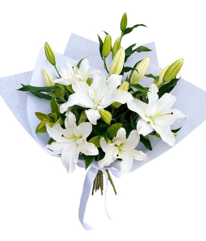 Wrapped bundle of all white lilies