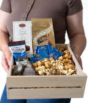 Alternative image 1 for A gourmet gift basket with assorted chocolates and treats, including Lindt Lindor truffles, Marich dark chocolate sea salt caramels, French truffles, Ghirardelli dark chocolate sea salt caramel squares, chocolate-covered cookies, caramel popcorn, and more