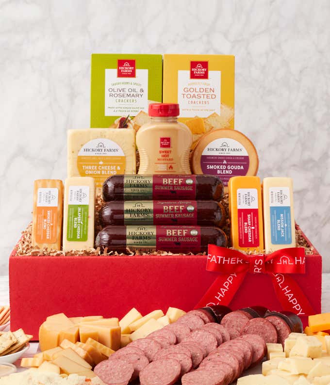 Fathers Day gift box featuring beef summer sausages, Smoked Gouda, Three Cheese & Onion, and Mission Jack cheeses, sweet hot mustard, golden toasted and olive oil & rosemary crackers, and a red ribbon that reads Happy Fathers Day.