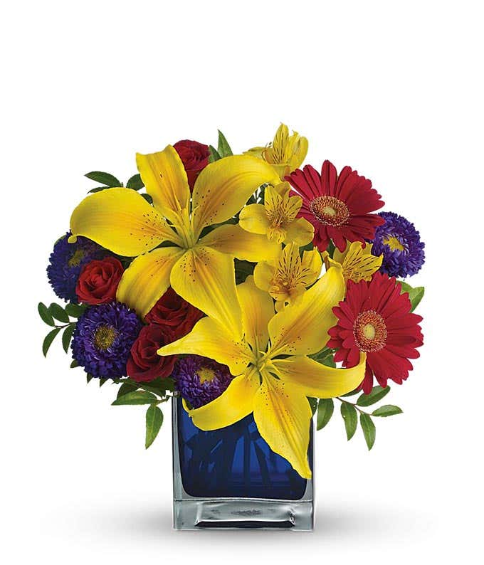 Yellow lilies, red flowers and purple asters bouquet