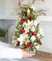 Alternative image 1 for A flower Christmas tree with white and red flowers in a gold vase