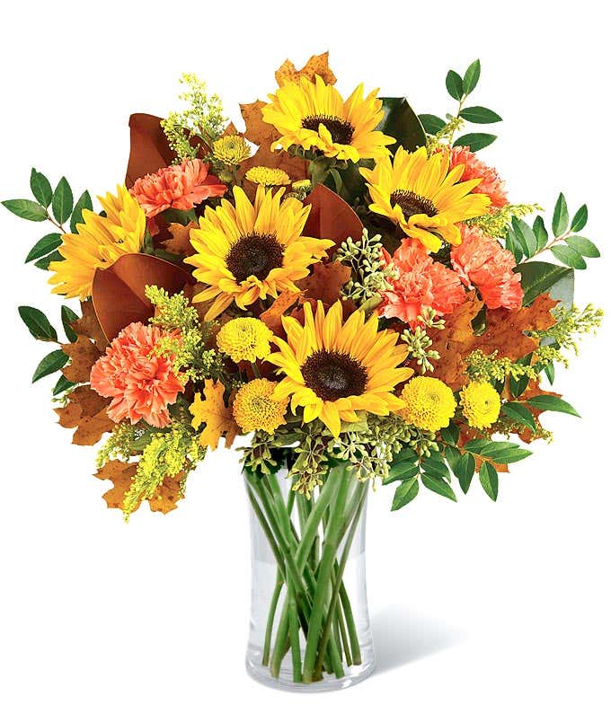 Mixed Fall bouquet with sunflowers, orange carnations and oak leaves