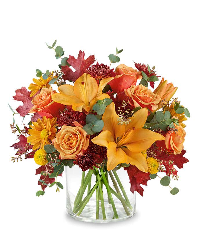 Tall fall bouquet with orange lilies, orange roses and orange daisies
