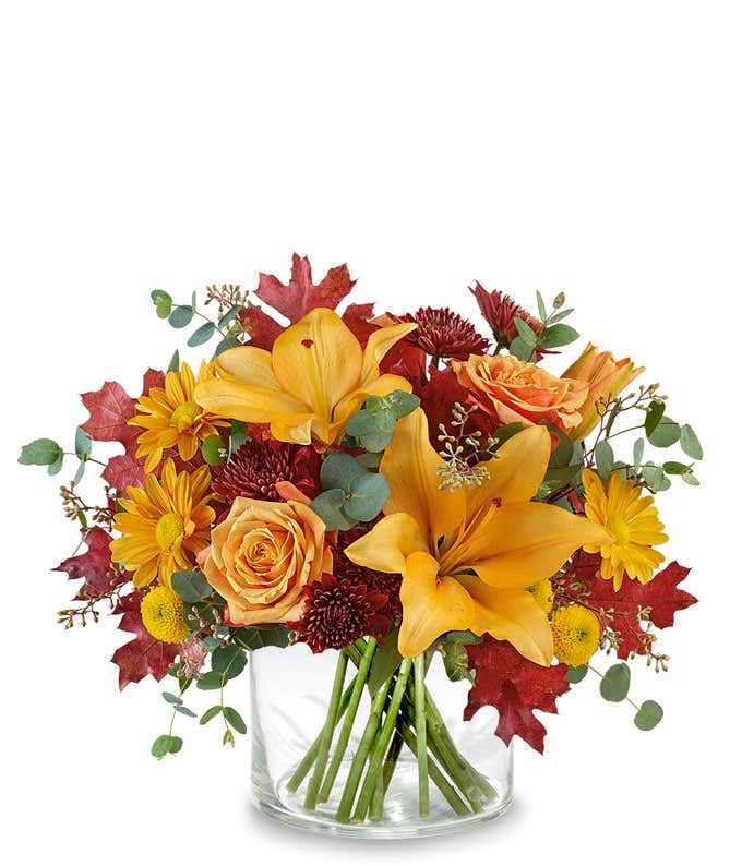 Tall fall bouquet with orange lilies, orange roses and orange daisies