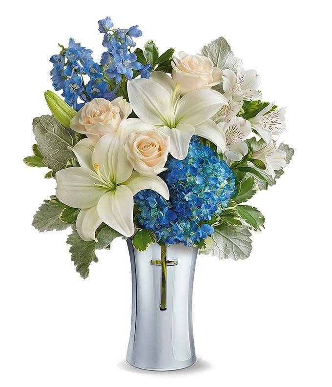 Cross vase with white roses and blue hydrangea