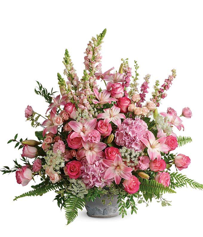 Funeral Bouquet: Light pink hydrangea, roses, spray roses, asiatic lilies, lisianthus, larkspur, snapdragons, and floral greenery arranged in a Grey Parisian Garden Pot.