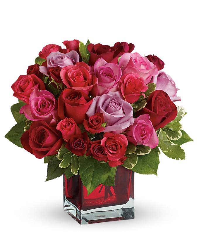 Romantic roses in square red vase