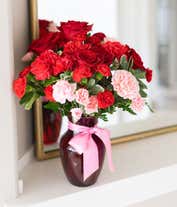 Alternative image 4 for Red roses, pink carnations in a red vase for a romantic bouquet