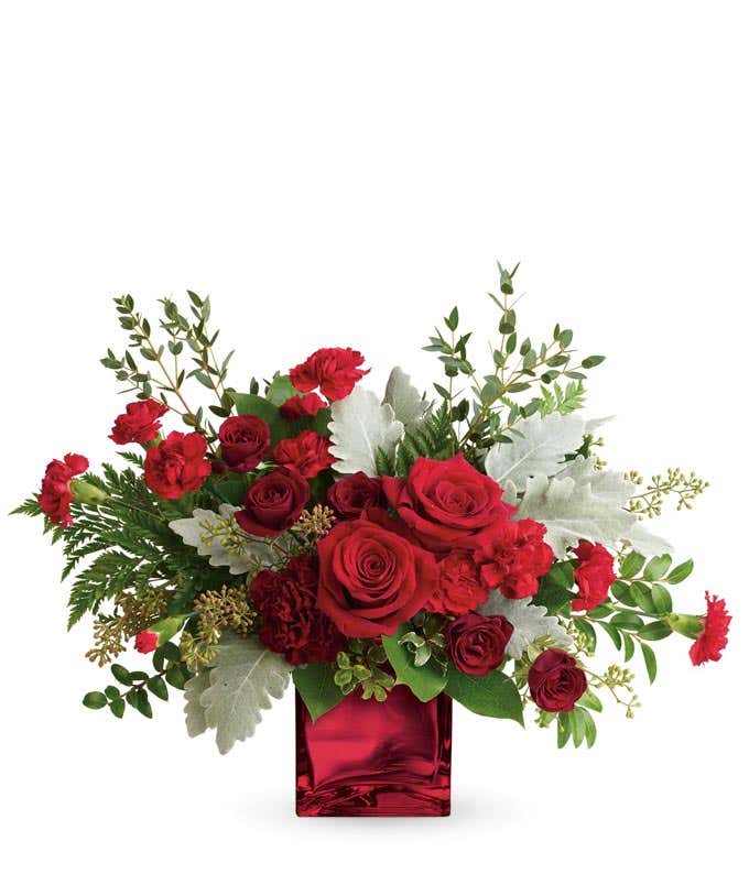 Luxury red rose and red carnations bouquet in a red cube vase